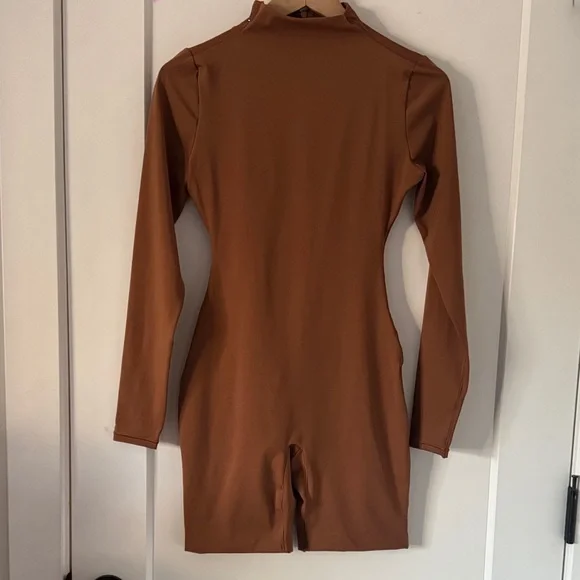 SKIMS | Pants & Jumpsuits | Nwot Skims Brown Bodycon Jumpsuit Mock Neck Long Sleeve Romper | Poshmark SKIMS | Pants & Jumpsuits | Nwot Skims Brown Bodycon Jumpsuit Mock Neck Long Sleeve Romper | Poshmark
